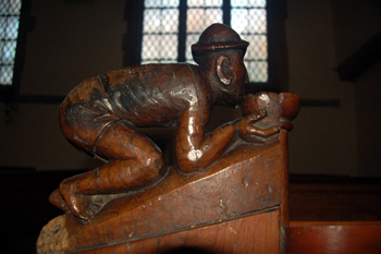 Side view of a drinking man bench end January 2010